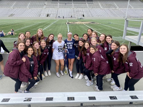 Team Attends Rivalry Game to Cheer Alums