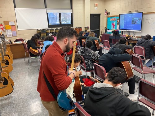 Middle School students worked on their guitar skills.