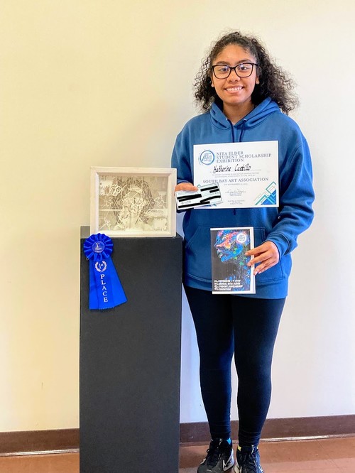 A High School student won first place in an art exhibition.