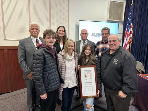 The Board of Education recognized the student who designed the ֱ holiday card.